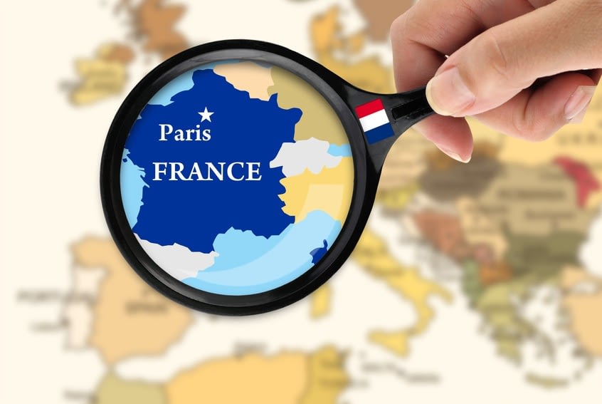 Magnifying glass over a map of France